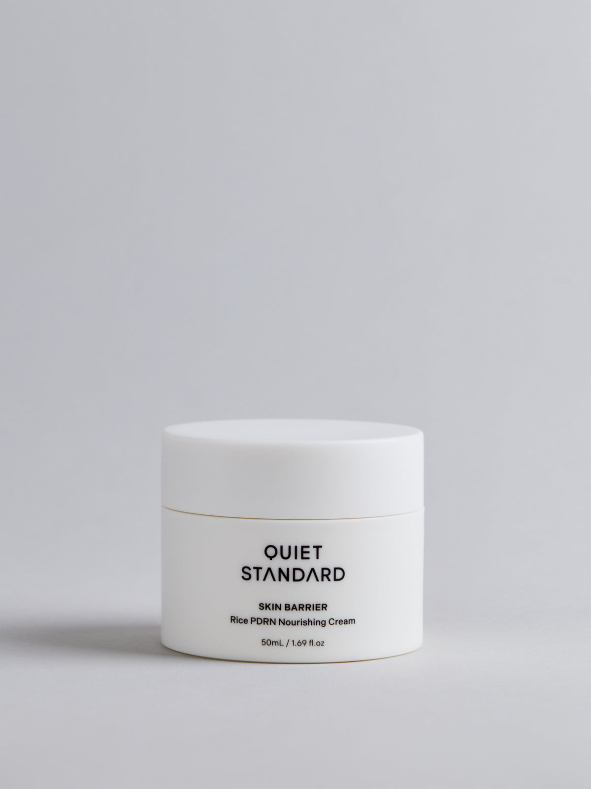 A white cosmetic jar of Quiet Standard Skin Barrier Rice PDRN Nourishing Cream, set against a clean light gray background.
