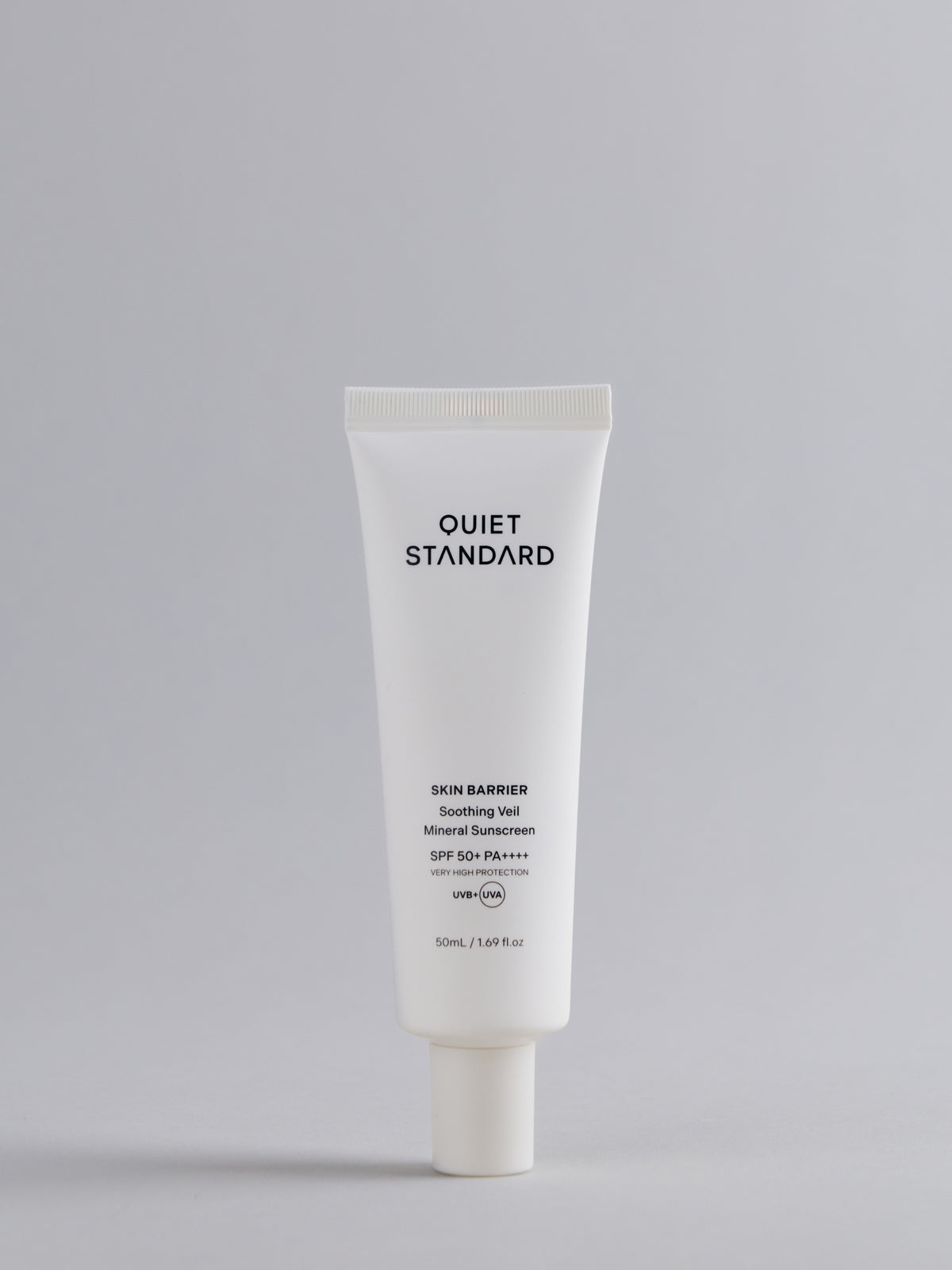A white squeeze tube of Quiet Standard Skin Barrier Soothing Veil Mineral Sunscreen SPF 50+ PA++++ against a solid light gray background.