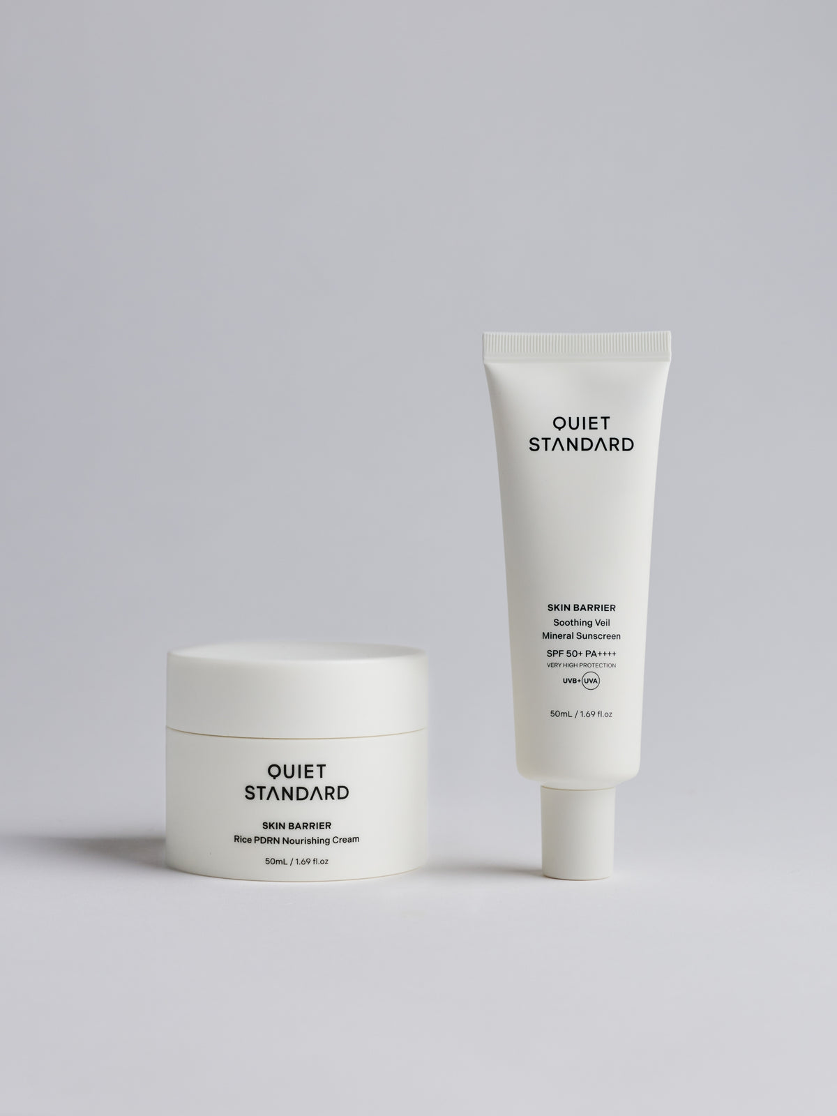 Rice PDRN Nourishing Cream and Soothing Veil Mineral Sunscreen from Quiet Standard, photographed on a clean light gray studio background.